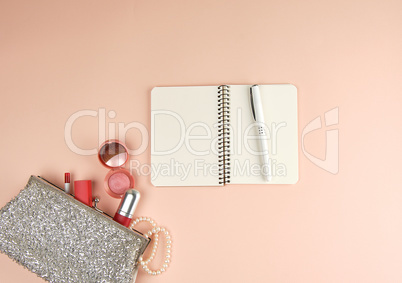 open notebook with clean white sheets and a pen