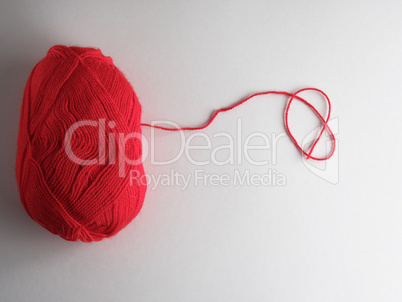 big skein of red wool on a white background, top view