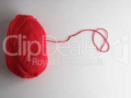 big skein of red wool on a white background, top view
