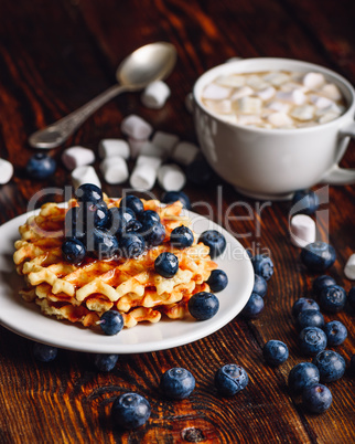 Waffles with Blueberry and Cup of Cocoa.