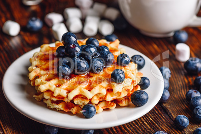 Belgian Waffles with Blueberry and Syrup.