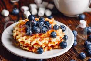 Belgian Waffles with Blueberry and Syrup.