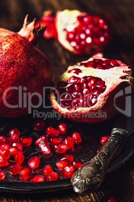 Ruby Pomegranate with Seeds and Knife.