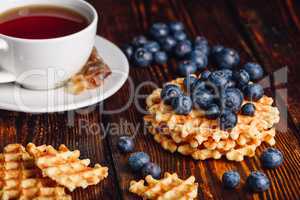 Waffles with Blueberry and Cup of Tea.