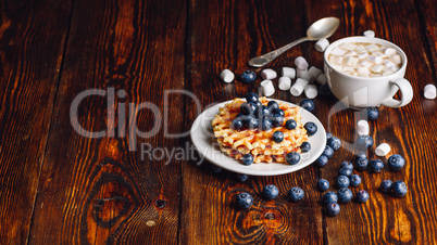 Waffles with Blueberry and Cup of Cocoa.