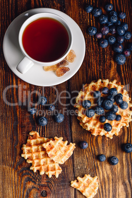 Cup of Tea with Belgian Waffles and Blueberries.