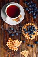 Cup of Tea with Belgian Waffles and Blueberries.