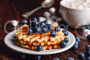 Waffles with Blueberry and Syrup.