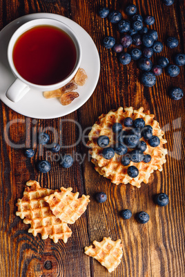 Cup of Tea with Belgian Waffles and Blueberries.