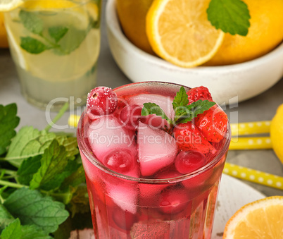 red strawberry lemonade in a glass
