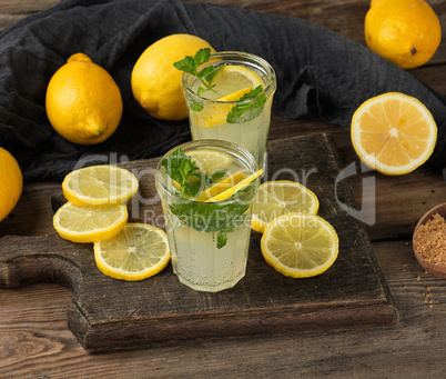 summer refreshing drink lemonade with lemons, mint leaves