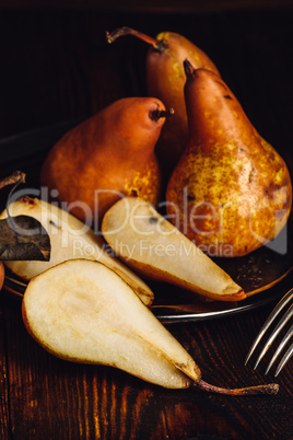 Few Golden Pears on Wooden Table.