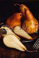 Few Golden Pears on Wooden Table.