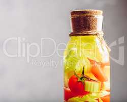 Bottle of Water with Tomato and Celery.
