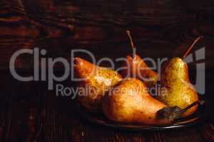 Few Golden Pears on Plate.