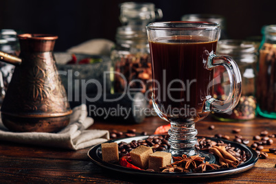 Cup of Coffee on Plate with Oriental Spices.