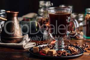 Cup of Coffee on Plate with Oriental Spices.