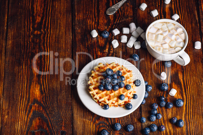 Waffles with Blueberry and Cup of Hot Chocolate.