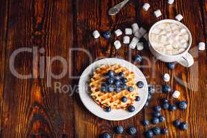 Waffles with Blueberry and Cup of Hot Chocolate.