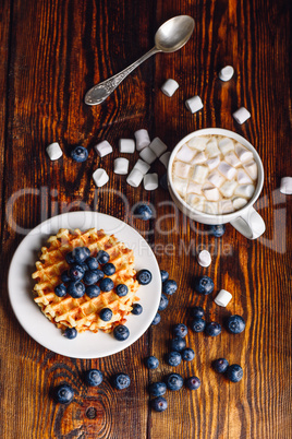 Waffles with Blueberry and Cup of Hot Chocolate.