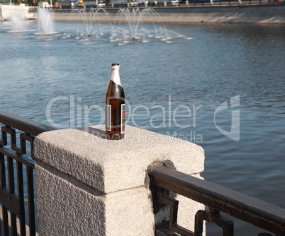 bottle on fence