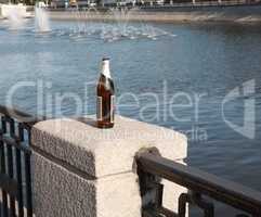 bottle on fence