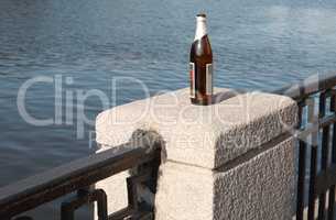 bottle on fence