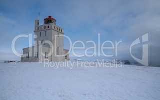 Lighthouse of Cape Dyrholaey, winter in Iceland