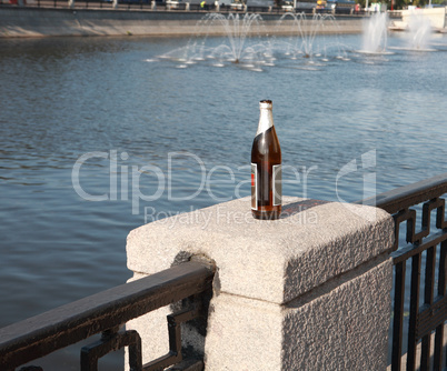 bottle on fence