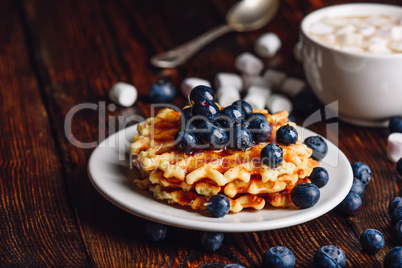 Waffles with Blueberry and Syrup.