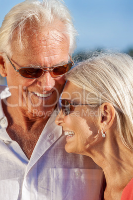 Happy Senior Couple Smiling Outside Wearing Sunglasses