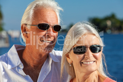Happy Senior Couple Smiling Outside Wearing Sunglasses