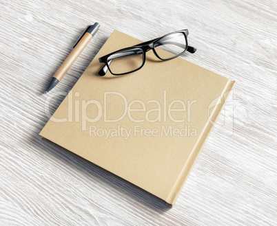 Notebook, glasses, pen
