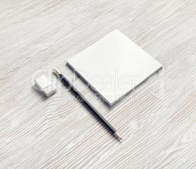 Notebook, pencil and eraser