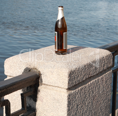 bottle on fence