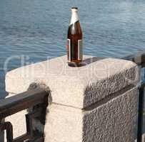 bottle on fence