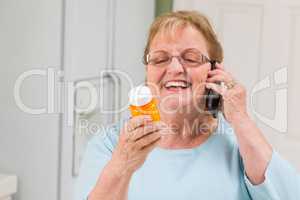 Senior Adult Woman on Cell Phone Holding Prescription Bottle