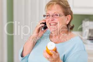Senior Adult Woman on Cell Phone Holding Prescription Bottle
