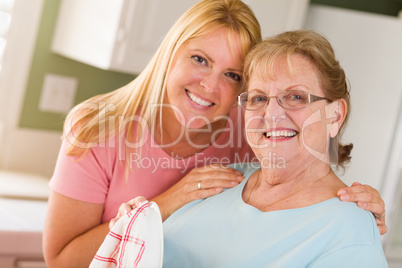 Portrait of Smiling Senior Adult Woman and Young Daughter