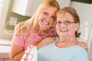 Portrait of Smiling Senior Adult Woman and Young Daughter