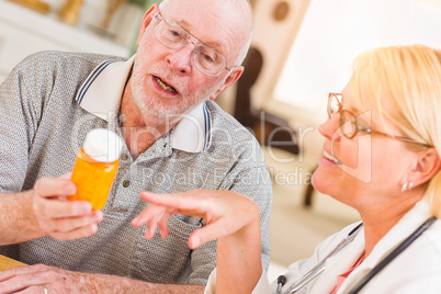 Doctor or Nurse Explaining Prescription Medicine to Senior Man