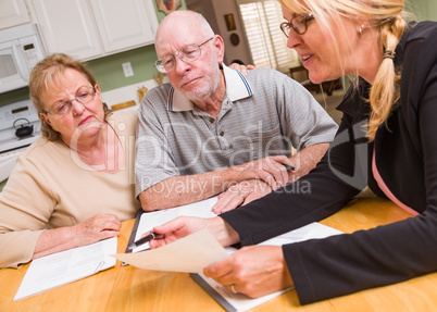 Senior Adult Couple Going Over Documents with Agent