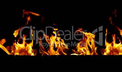 bright orange and yellow flames on a black background,close up