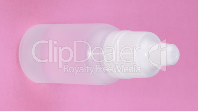 White Plastic Vial on Pink Background