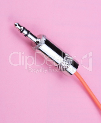 Stereo Male Plug Connector on Pink Background