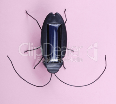 Electronic Bug Toy on Pink Background