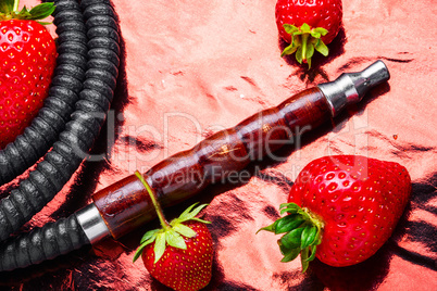 Smoking hookah on strawberry