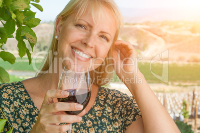 Beautiful Young Adult Woman Enjoying Glass of Wine n The Vineyard