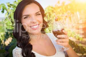 Beautiful Young Adult Woman Enjoying Glass of Wine in The Vineyard