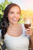 Beautiful Young Adult Woman Enjoying Glass of Wine in The Vineyard